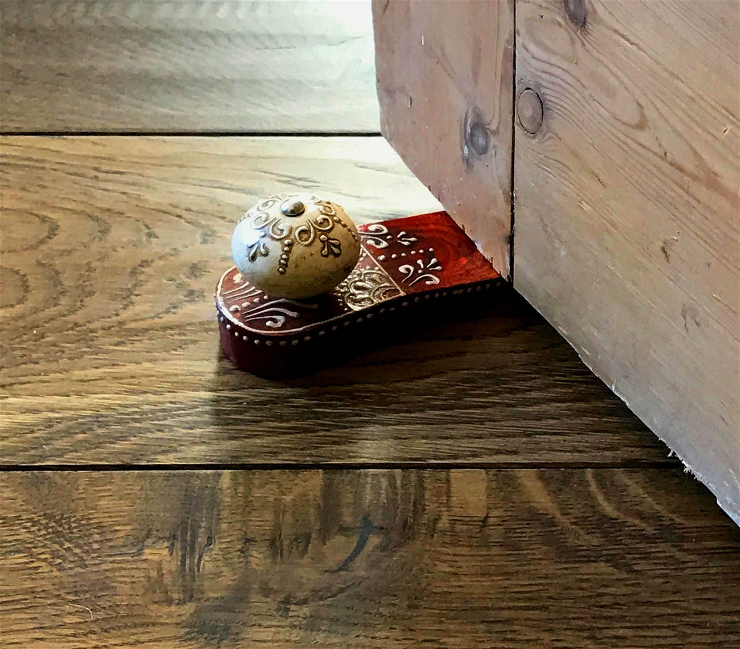 Red Doorstop With Wooden Knob